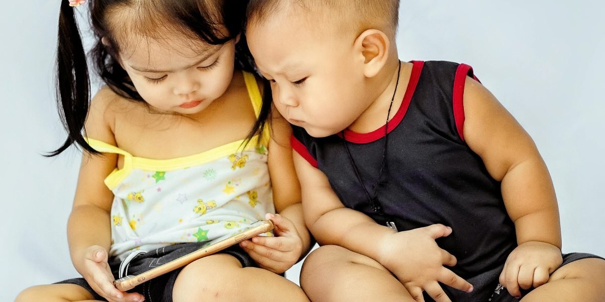 A young child intently watching educational content on a tablet, feeling a direct connection.