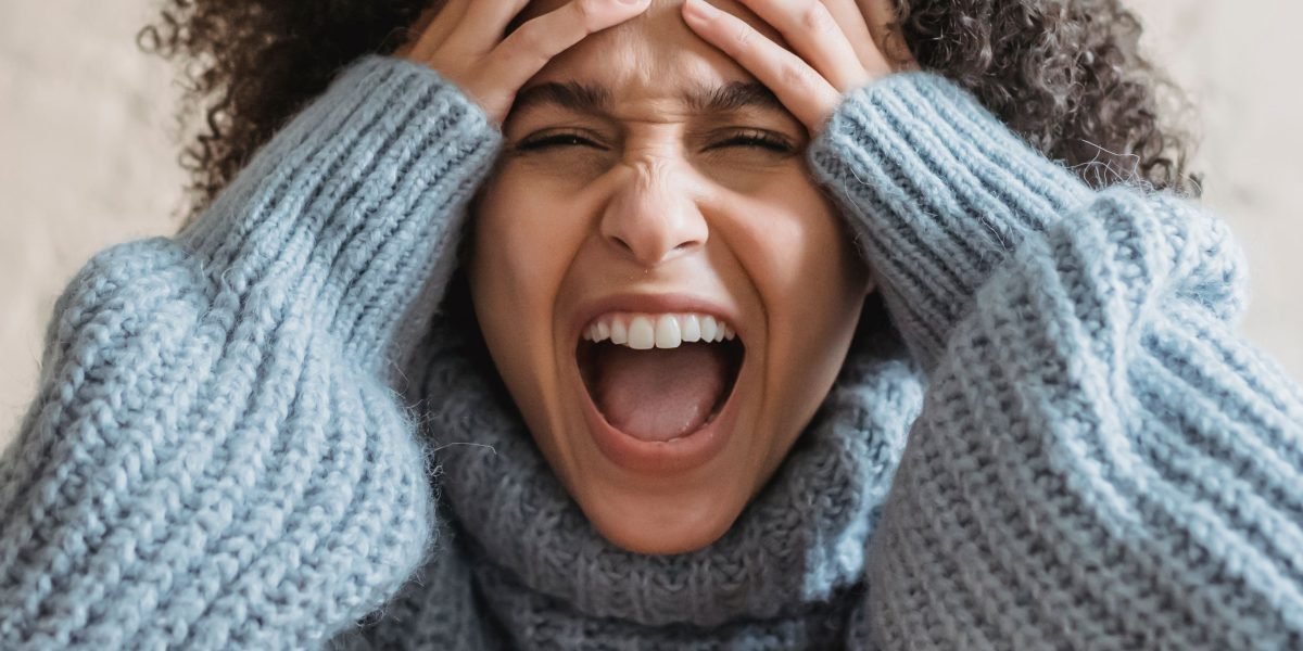 A person looking overwhelmed while browsing numerous tech options, reflecting the initial frustration of router shopping.