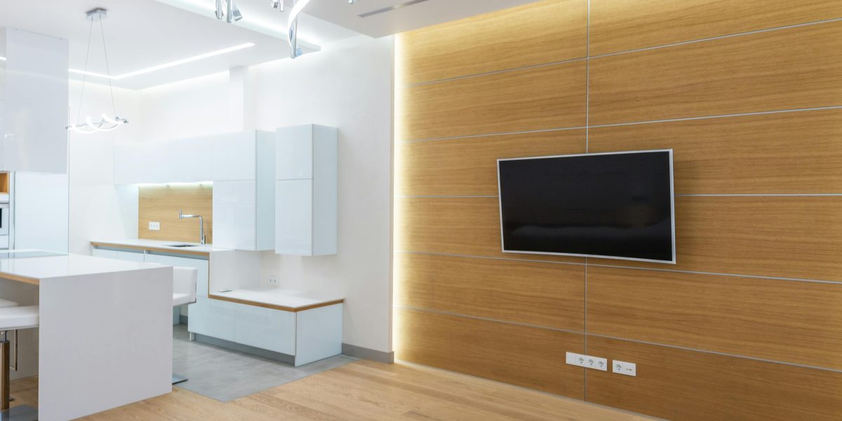 A stylish living room featuring well-integrated and discreet technology, showing how a router can blend into home decor.